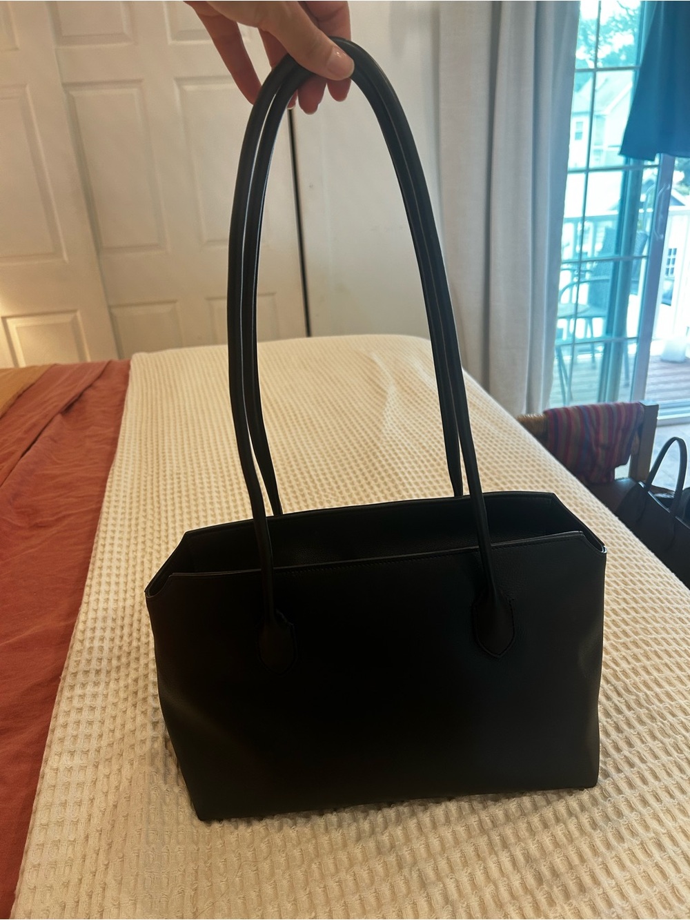 The Row “Terrasse” bag in black. Sold out everywhere